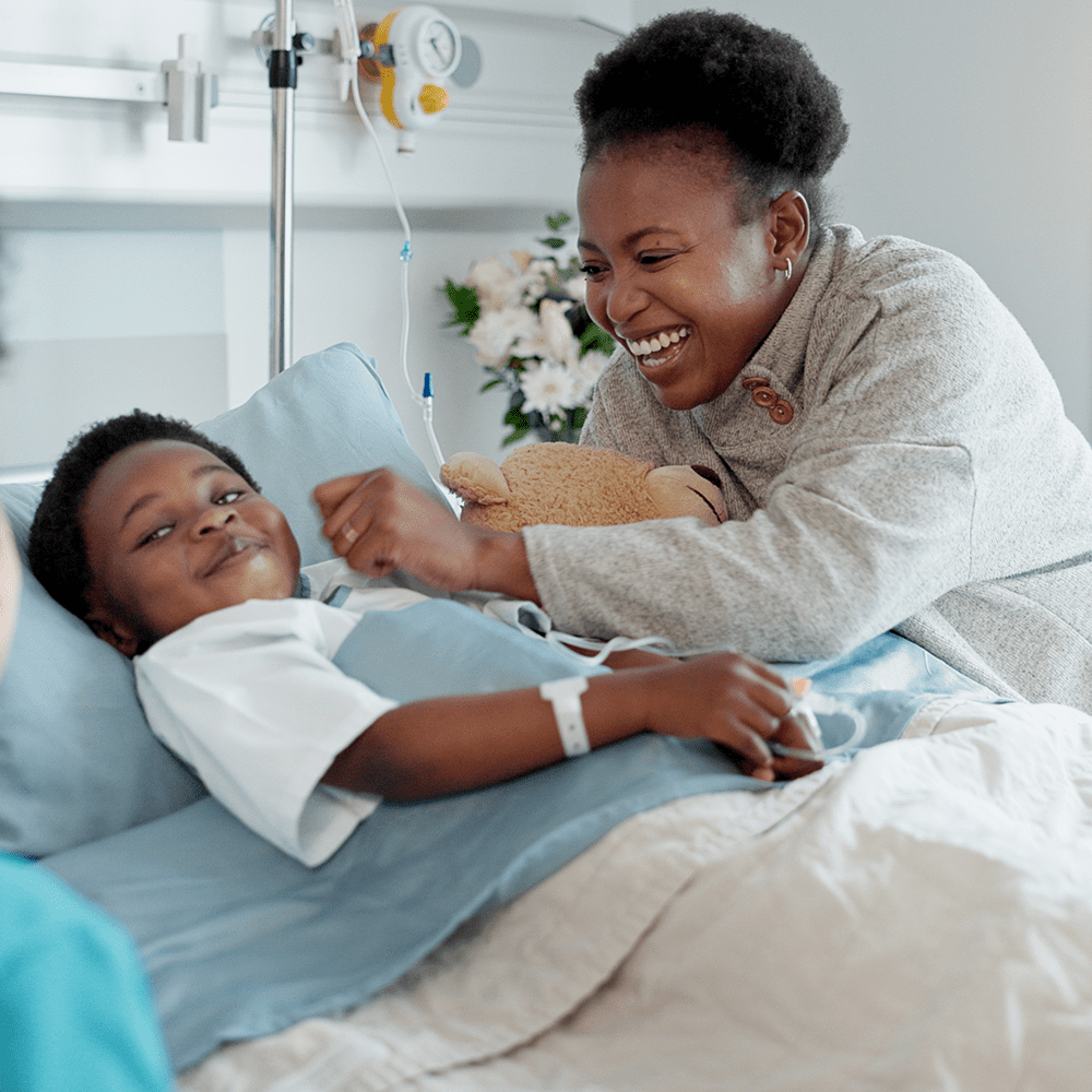 An advocate by a patient bedside in a hospital