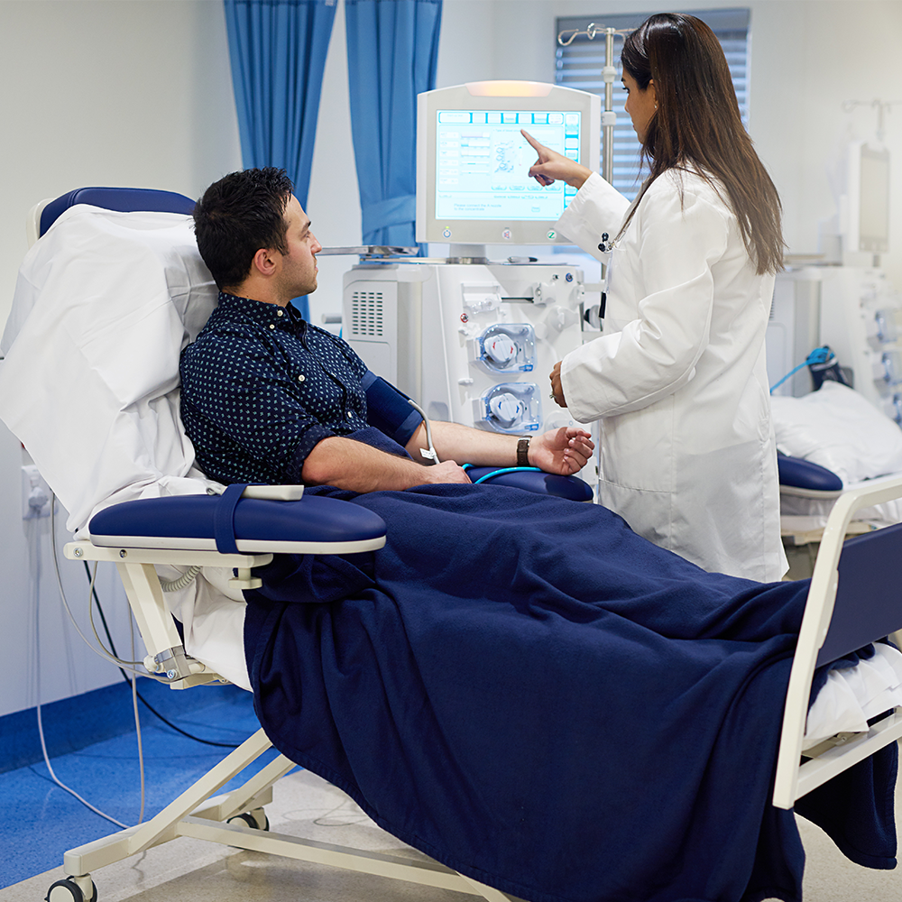 A patient receiving kidney dialysis in a hospital
