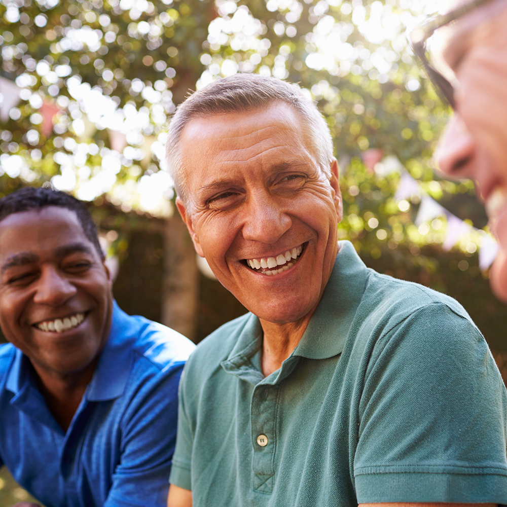 Three men smiling