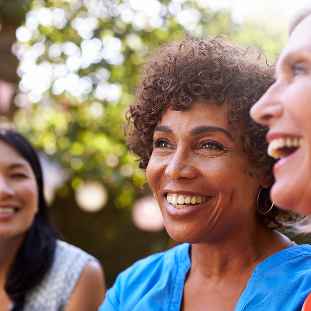Three women smiling